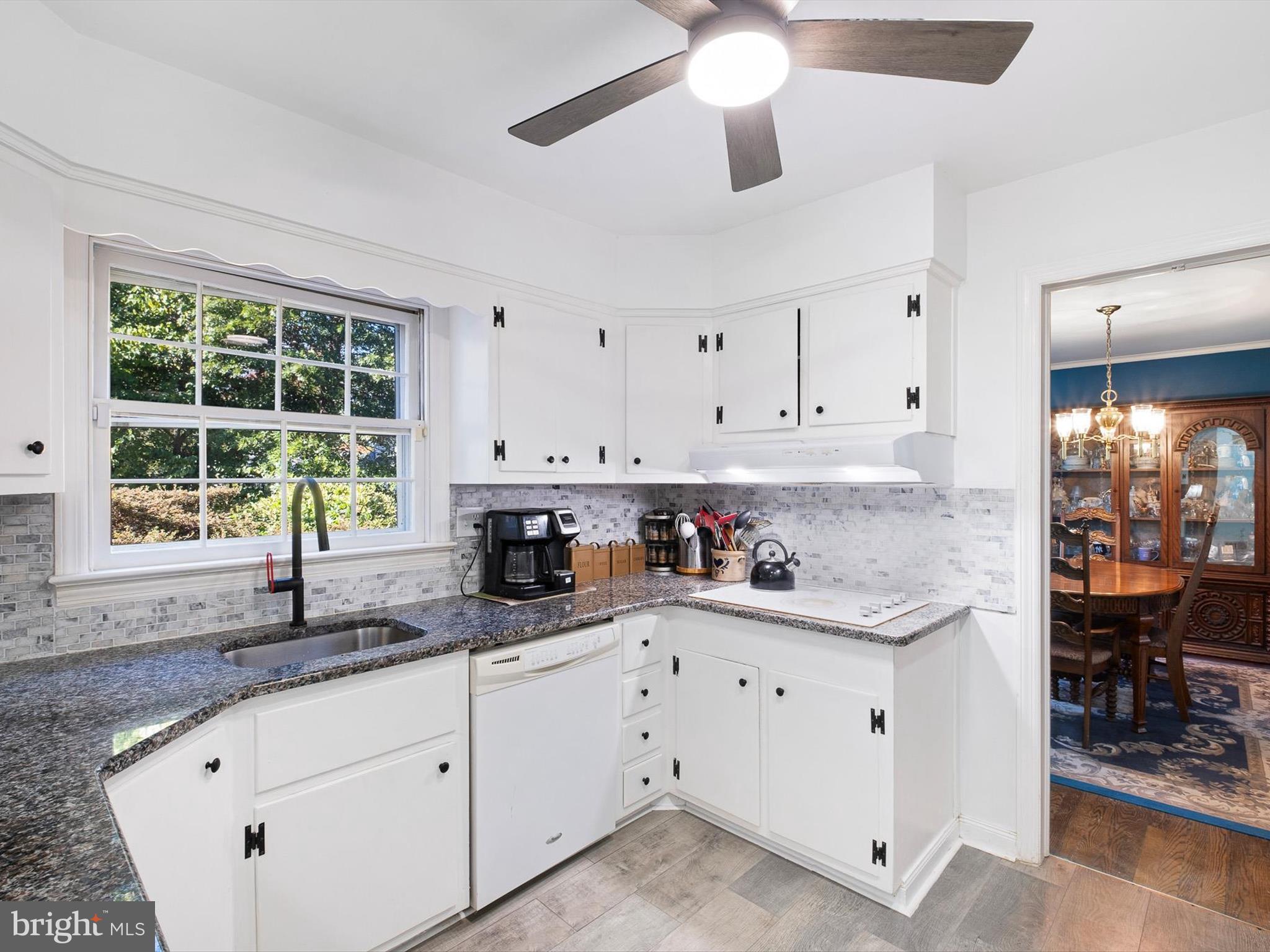133 Marcella Road Wilmington, DE 19803 - Photo 10 of 27 a kitchen with a sink window and cabinets