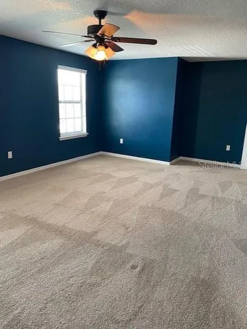 a view of an empty room with windows