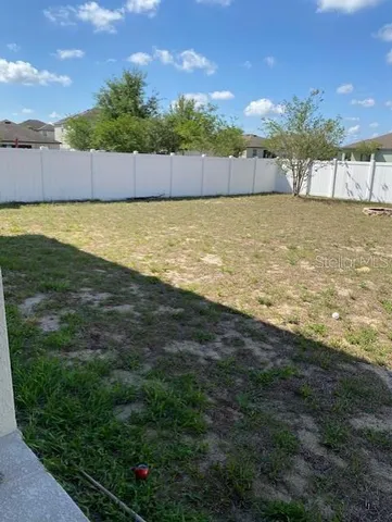 a view of a swimming pool and an outdoor space