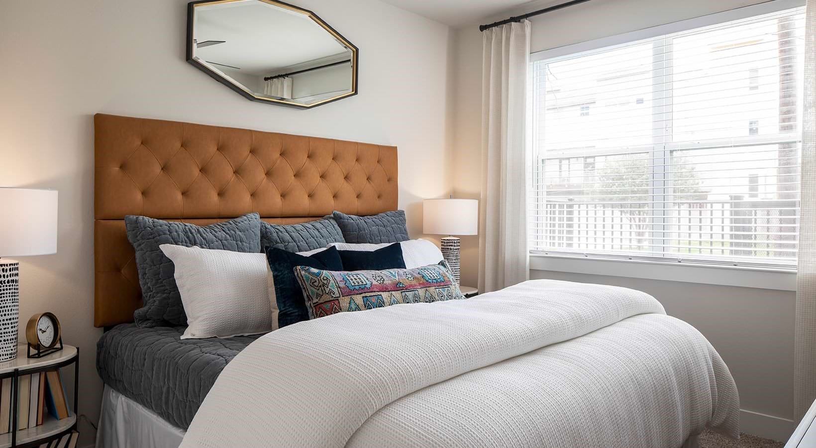 2425 Bell Street, Unit 1201 Houston, TX 77003 - Photo 6 of 30 a bedroom with a large bed and a large window