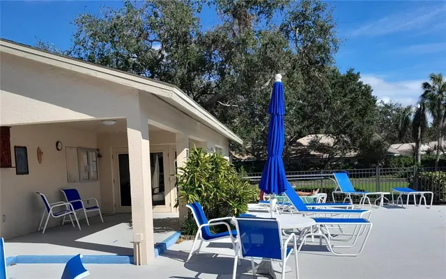 a table and chairs sitting in front of a building