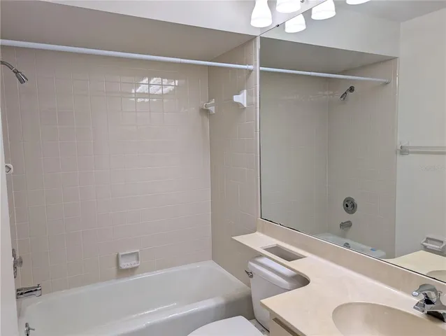 a bathroom with a tub and a sink