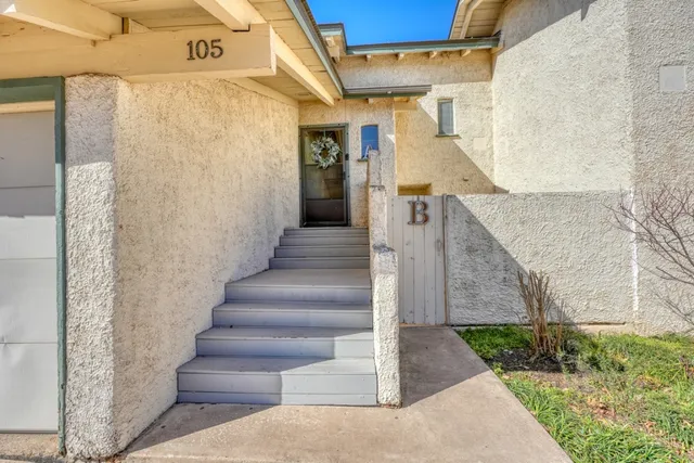 a view of a pathway of a house with wooden floor