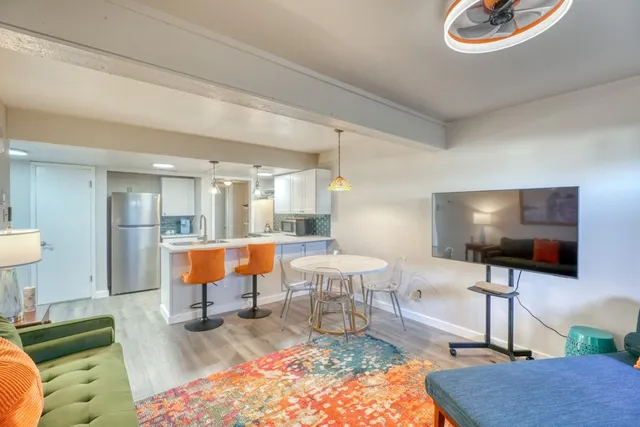 a living room with furniture and a flat screen tv