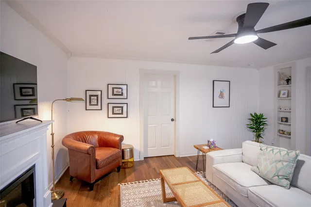 a living room with furniture and a fireplace