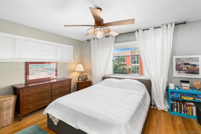 a bed room with a bed and a window