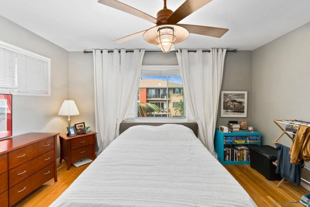 a bed room with a bed and a chandelier