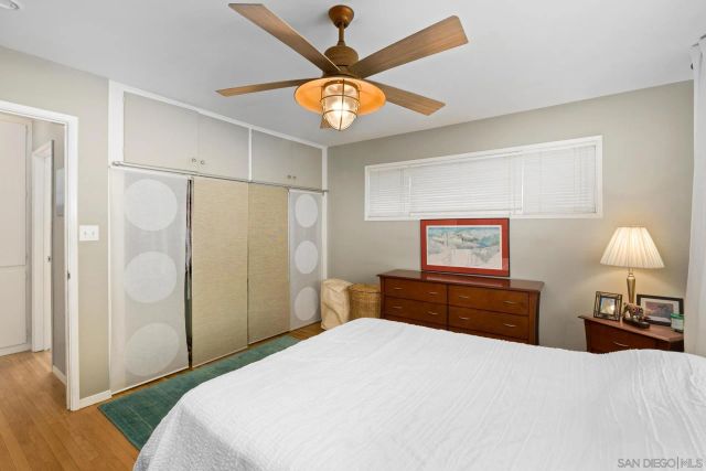 a view of a porch with furniture and a yard