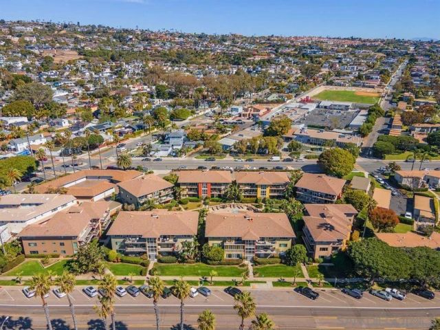 aerial view of a house with a yard