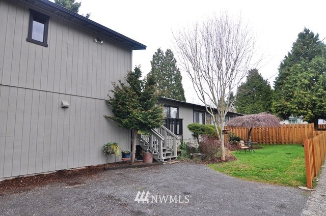660 Index Place Northeast Renton, WA 98056 - Photo 2 of 18 a view of a house with a yard