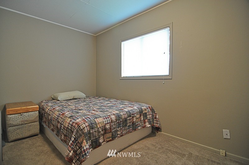 660 Index Place Northeast Renton, WA 98056 - Photo 11 of 18 a bedroom with a bed and a window