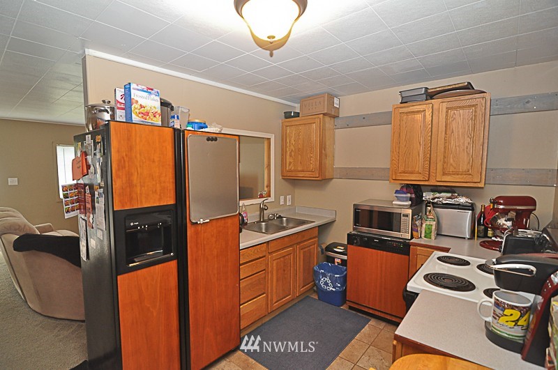 660 Index Place Northeast Renton, WA 98056 - Photo 13 of 18 a kitchen with stainless steel appliances granite countertop a refrigerator stove and sink