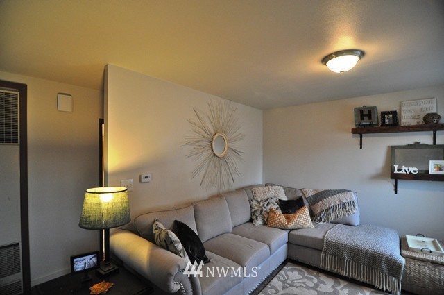 660 Index Place Northeast Renton, WA 98056 - Photo 15 of 18 a living room with furniture and a lamp
