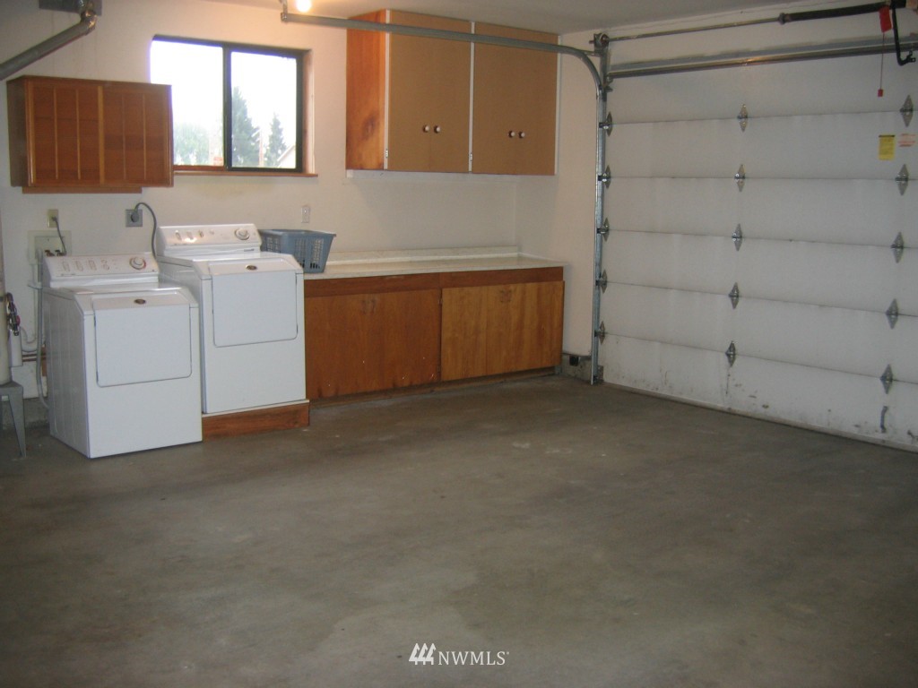 660 Index Place Northeast Renton, WA 98056 - Photo 17 of 18 a view of storage and utility room with washer and dryer