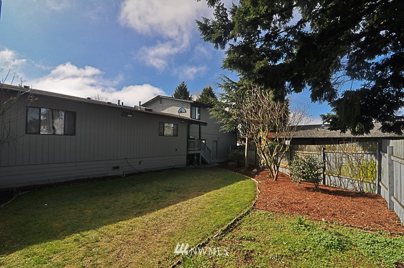 660 Index Place Northeast Renton, WA 98056 - Photo 18 of 18 a view of a backyard with a large tree