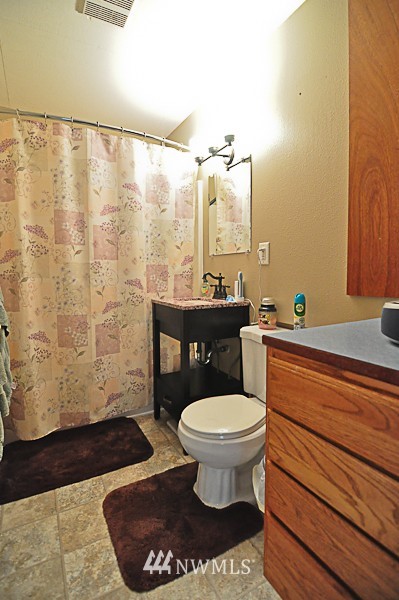660 Index Place Northeast Renton, WA 98056 - Photo 10 of 18 a bathroom with a sink toilet and a mirror