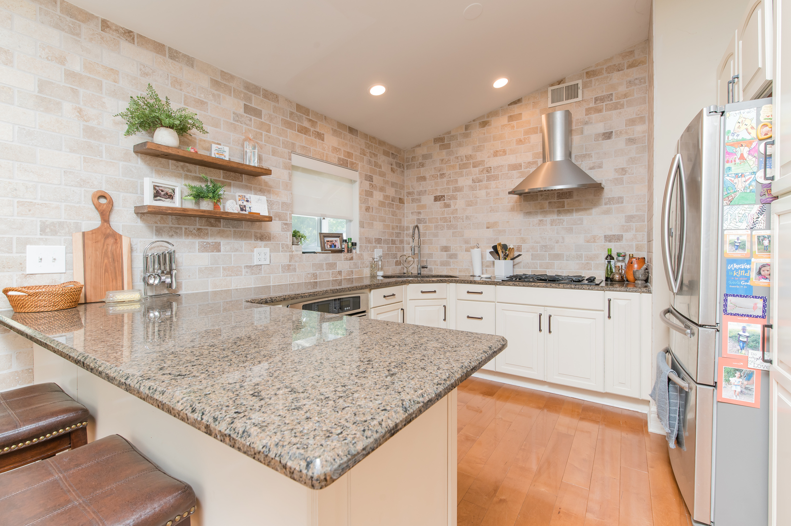 103 Oakleaf Road Lake In The Hills, IL 60156 - Photo 11 of 41 a kitchen with stainless steel appliances granite countertop a sink a stove and a refrigerator
