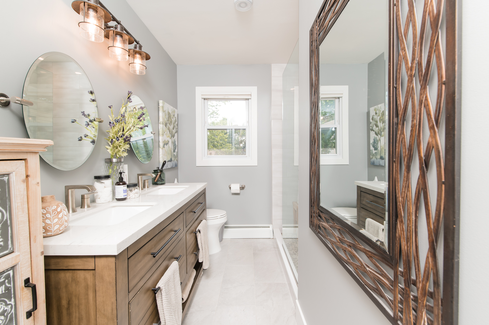 103 Oakleaf Road Lake In The Hills, IL 60156 - Photo 25 of 41 a spacious bathroom with a granite countertop sink and a mirror