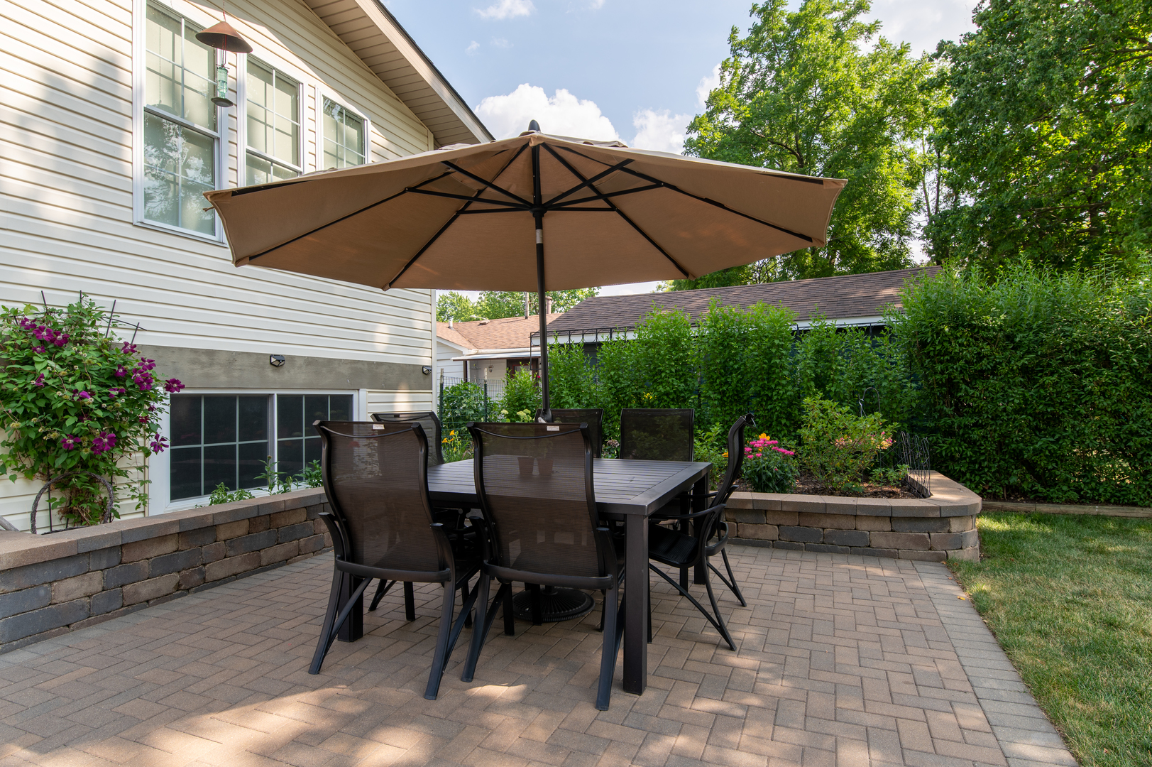 103 Oakleaf Road Lake In The Hills, IL 60156 - Photo 5 of 41 a view of table and chairs under an umbrella