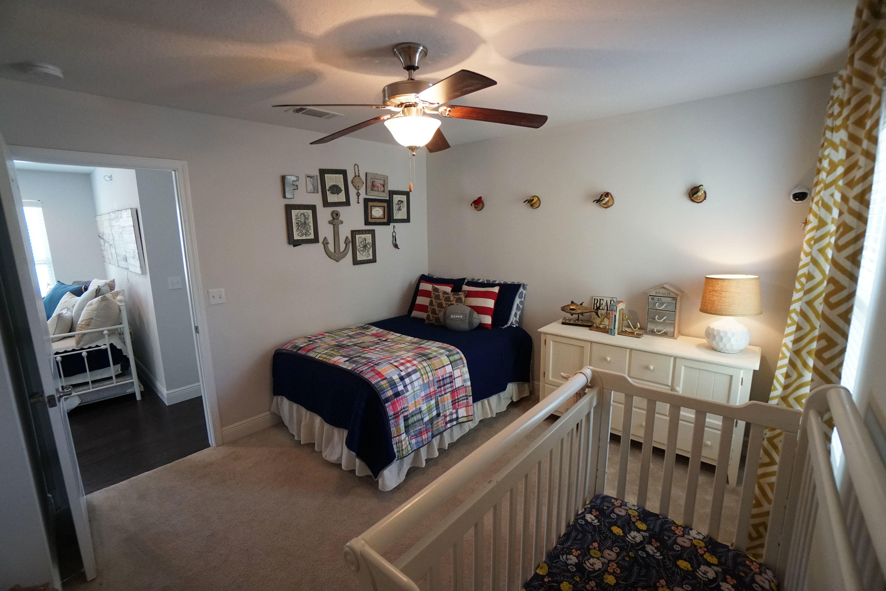 56 Sandpine Loop Inlet Beach, FL 32461 - Photo 15 of 22 a bedroom with a bed and a chandelier