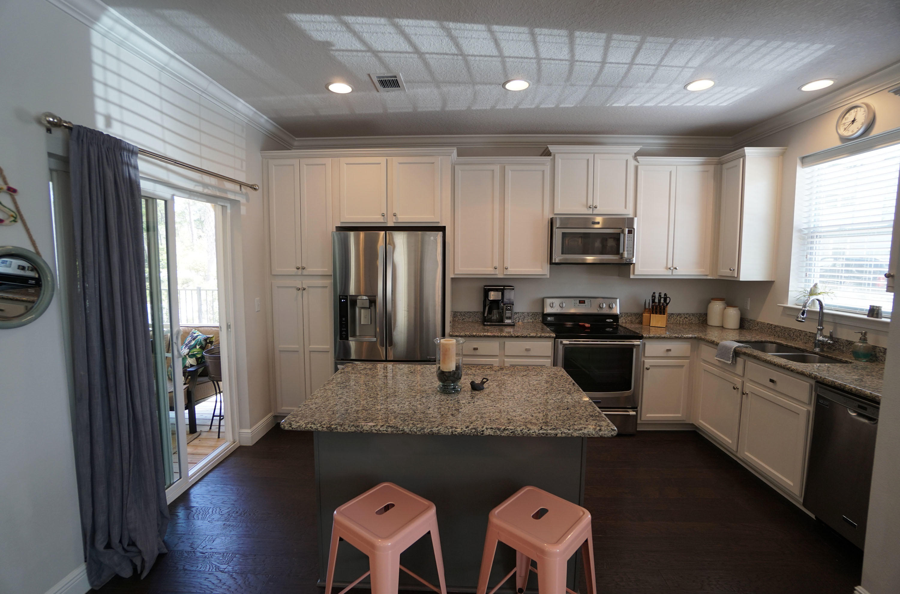 56 Sandpine Loop Inlet Beach, FL 32461 - Photo 6 of 22 a kitchen with stainless steel appliances granite countertop a refrigerator a stove top oven a sink and dishwasher