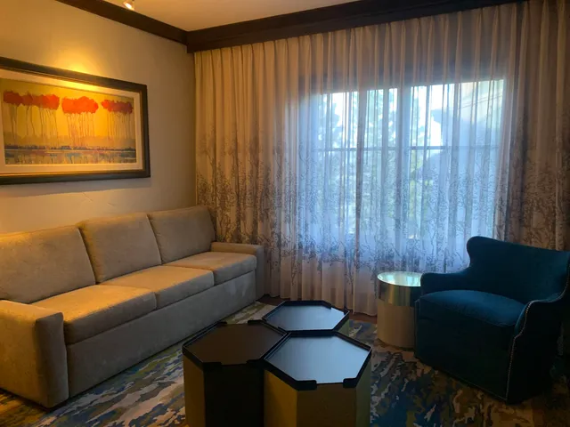 a living room with furniture and a window