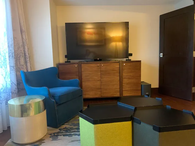 a living room with furniture and a flat screen tv