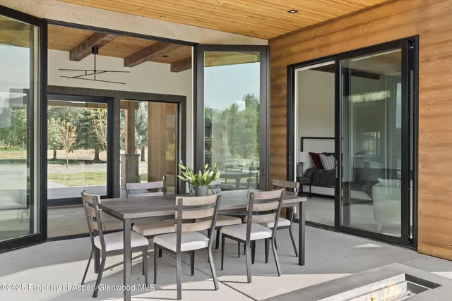 a dining room with furniture and window