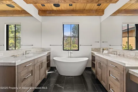 a bathroom with a sink and mirror