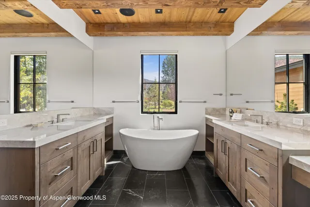 a bathroom with a sink and mirror