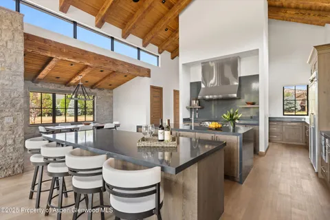 a kitchen with a sink stove and refrigerator