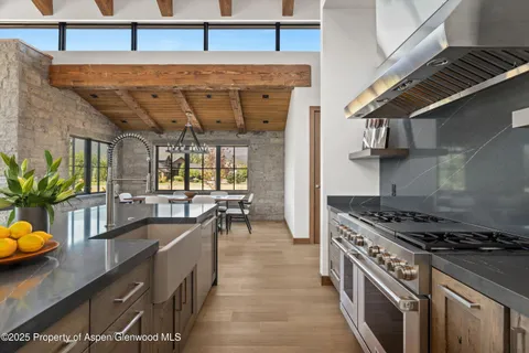 a kitchen with a stove and a sink