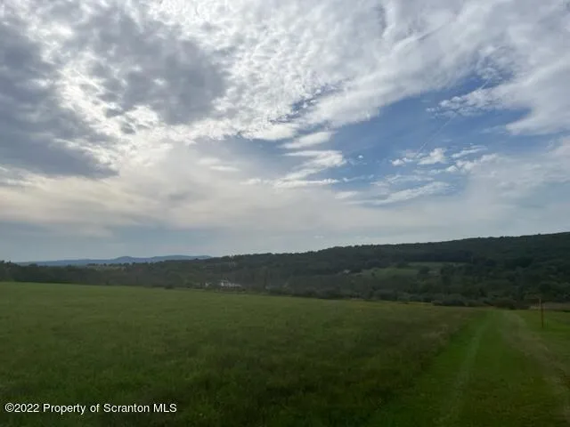 a view of an ocean and mountain