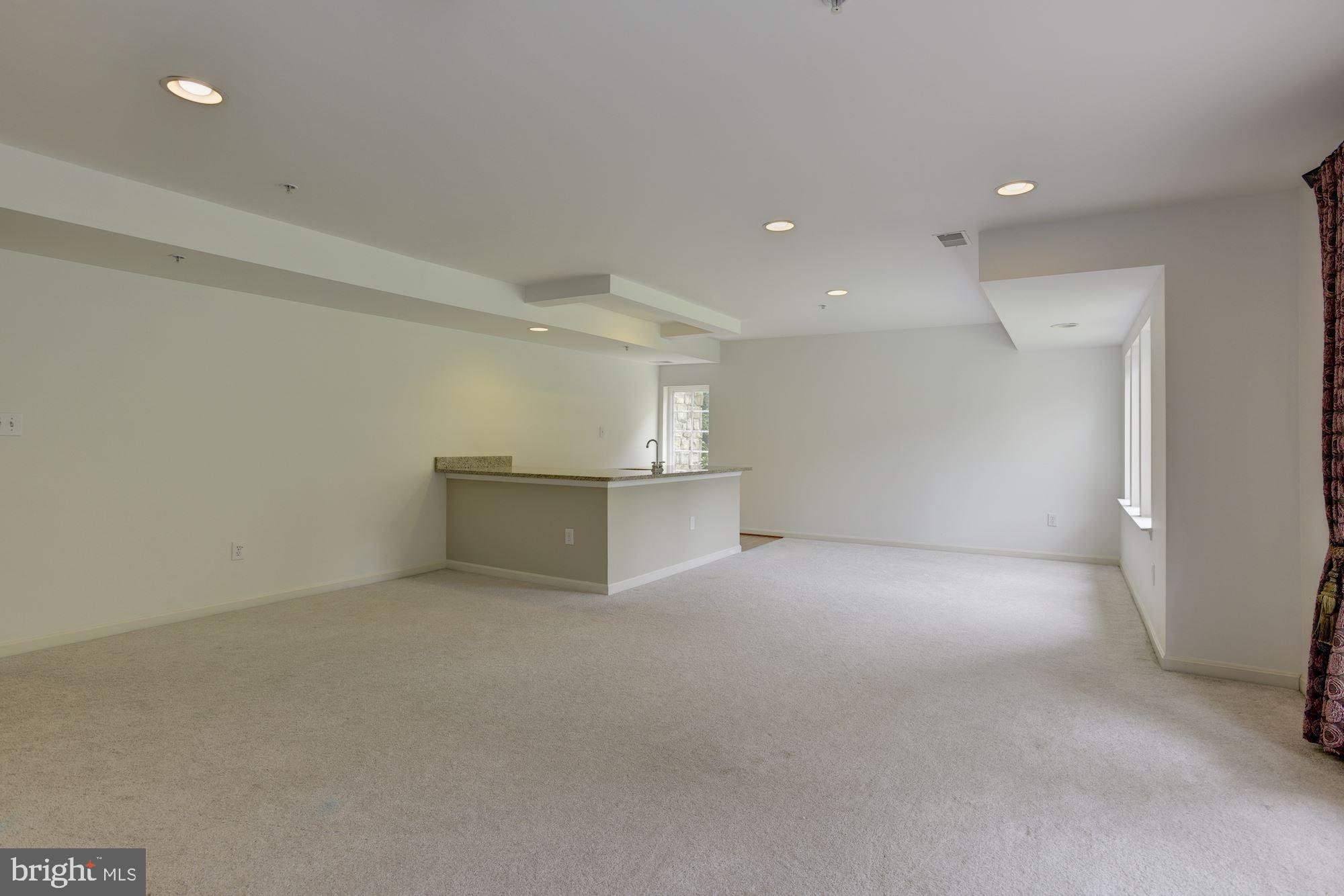 8761 Boulder Ridge Road Laurel, MD 20723 - Photo 27 of 44 Family Room | Wet Bar with Granite Countertops