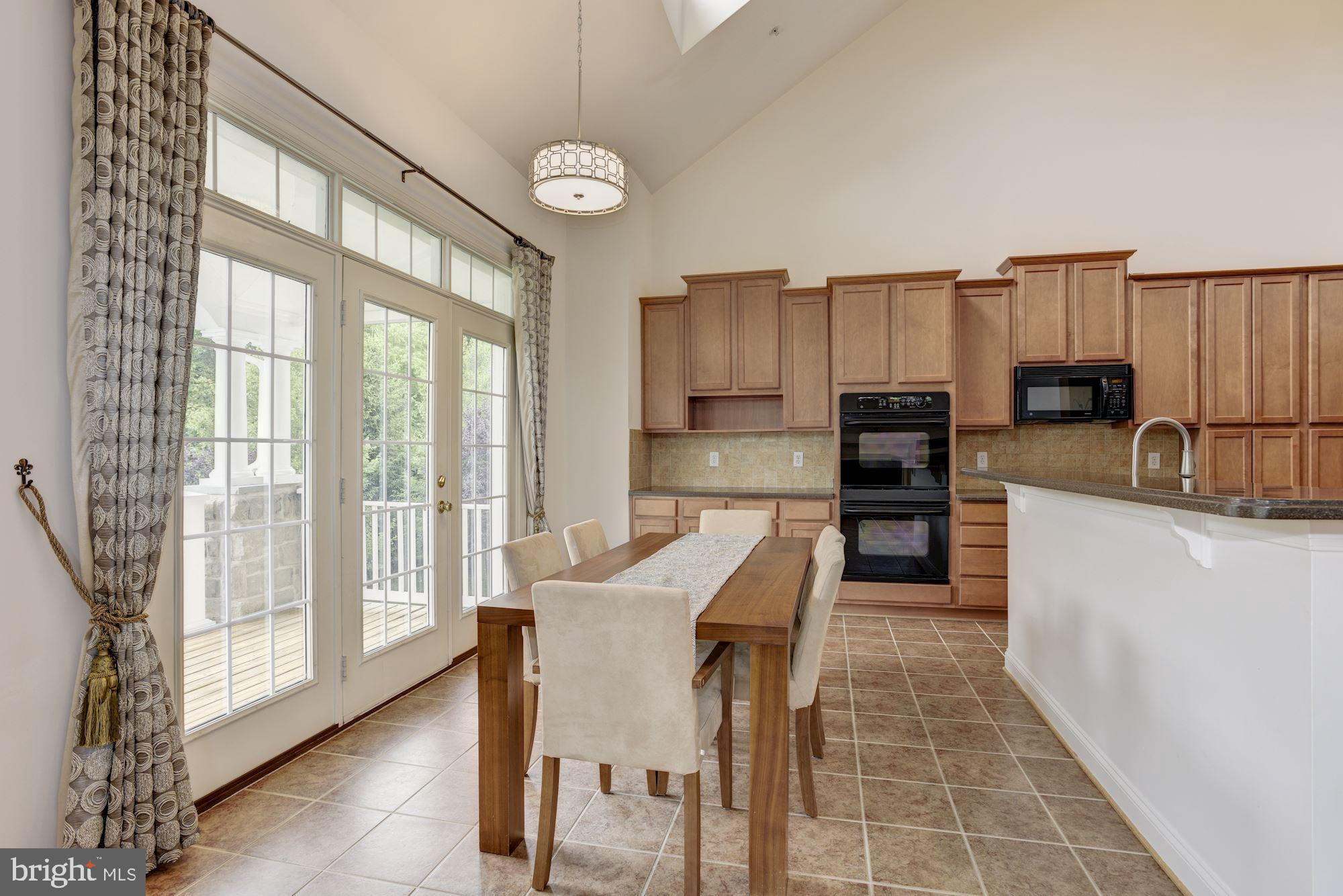 8761 Boulder Ridge Road Laurel, MD 20723 - Photo 9 of 44 Breakfast Room | Access to Three Seasons Balcony