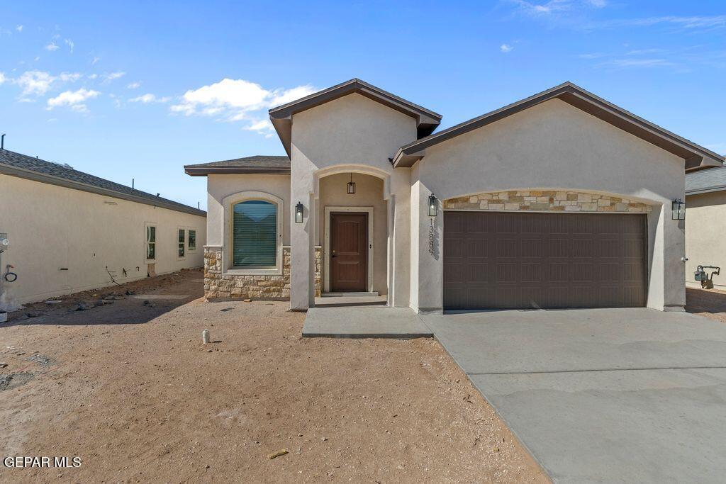 3761 Course Street El Paso, TX 79938 - Photo 1 of 15 a front view of a house with yard