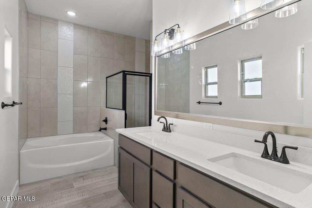 3761 Course Street El Paso, TX 79938 - Photo 11 of 15 a bathroom with a tub sink and mirror