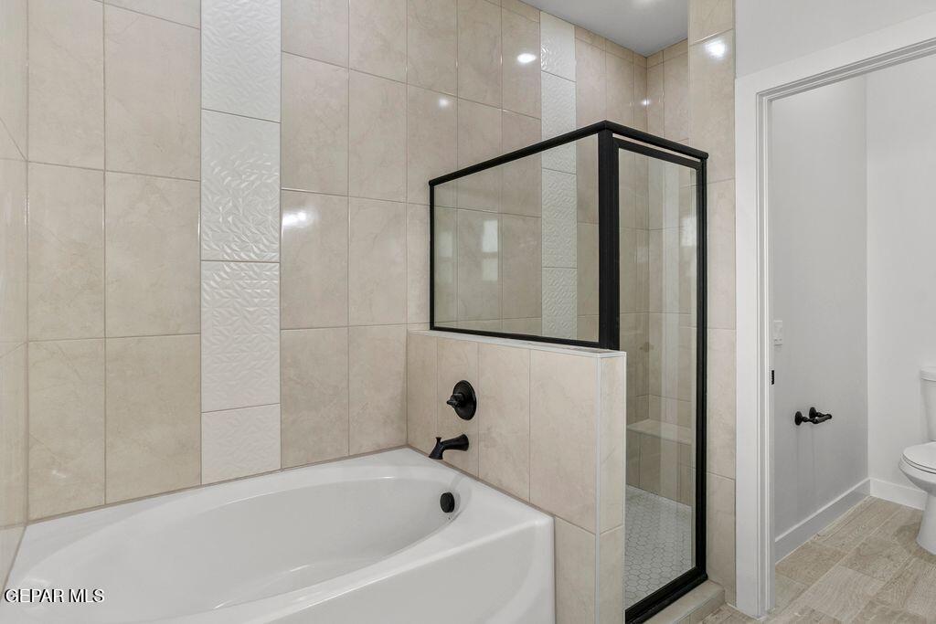 3761 Course Street El Paso, TX 79938 - Photo 12 of 15 a bathroom with a bathtub and a shower
