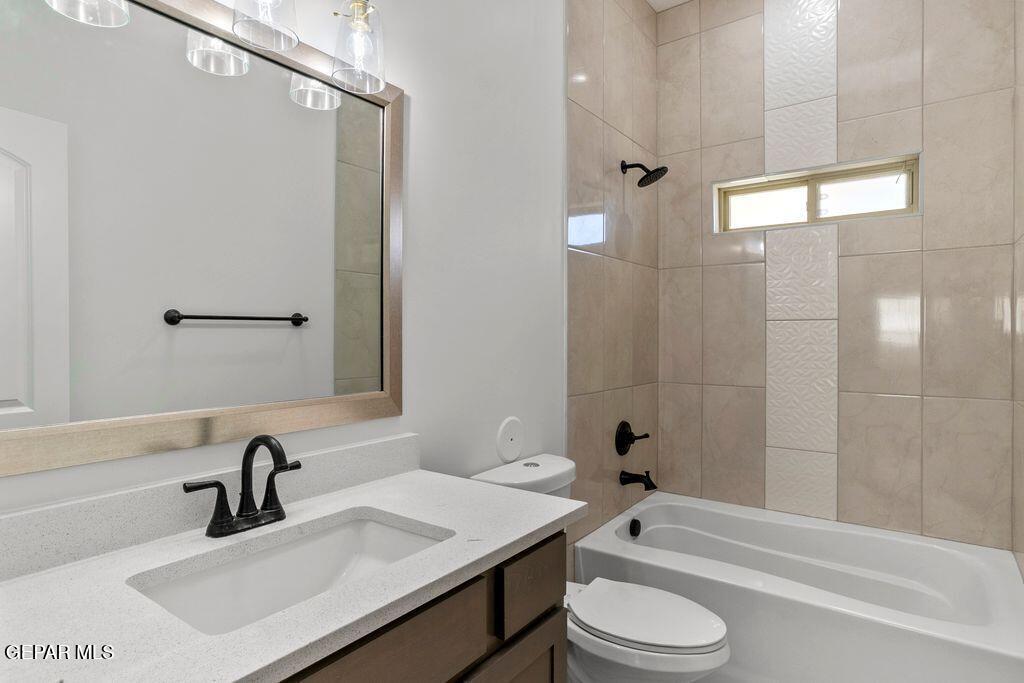 3761 Course Street El Paso, TX 79938 - Photo 13 of 15 a bathroom with a sink toilet and shower