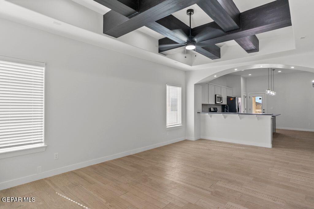 3761 Course Street El Paso, TX 79938 - Photo 2 of 15 an empty room with wooden floor and windows