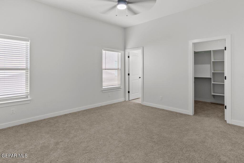 3761 Course Street El Paso, TX 79938 - Photo 8 of 15 an empty room with windows and a ceiling fan