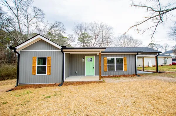 front view of a house with a yard