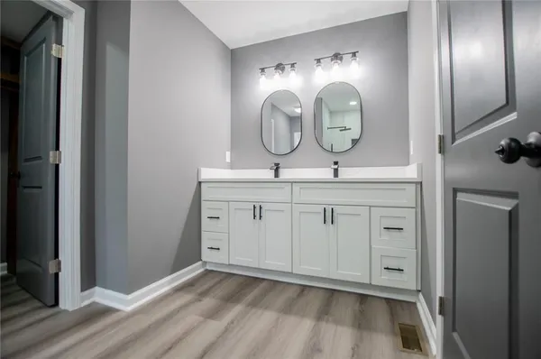 a view of an empty room and wooden floor