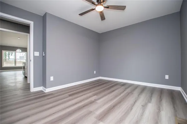 a view of a house with a door and wooden roof