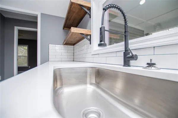 a bathroom with a sink vanity and a mirror