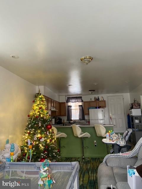 448 Hamilton Street Harrisburg, PA 17102 - Photo 5 of 12 a room with lots of flower plants and wooden floor