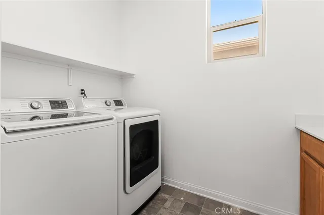 a view of a hallway with wooden shelves