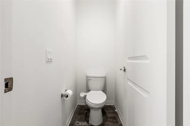 a bedroom with a bed and mirror