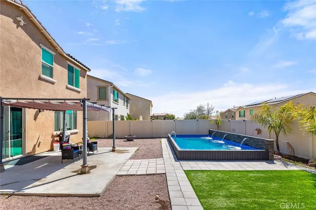 a view of swimming pool with patio