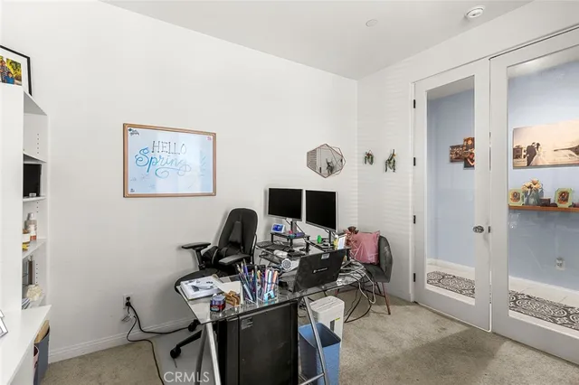 a bathroom with a sink mirror and toilet